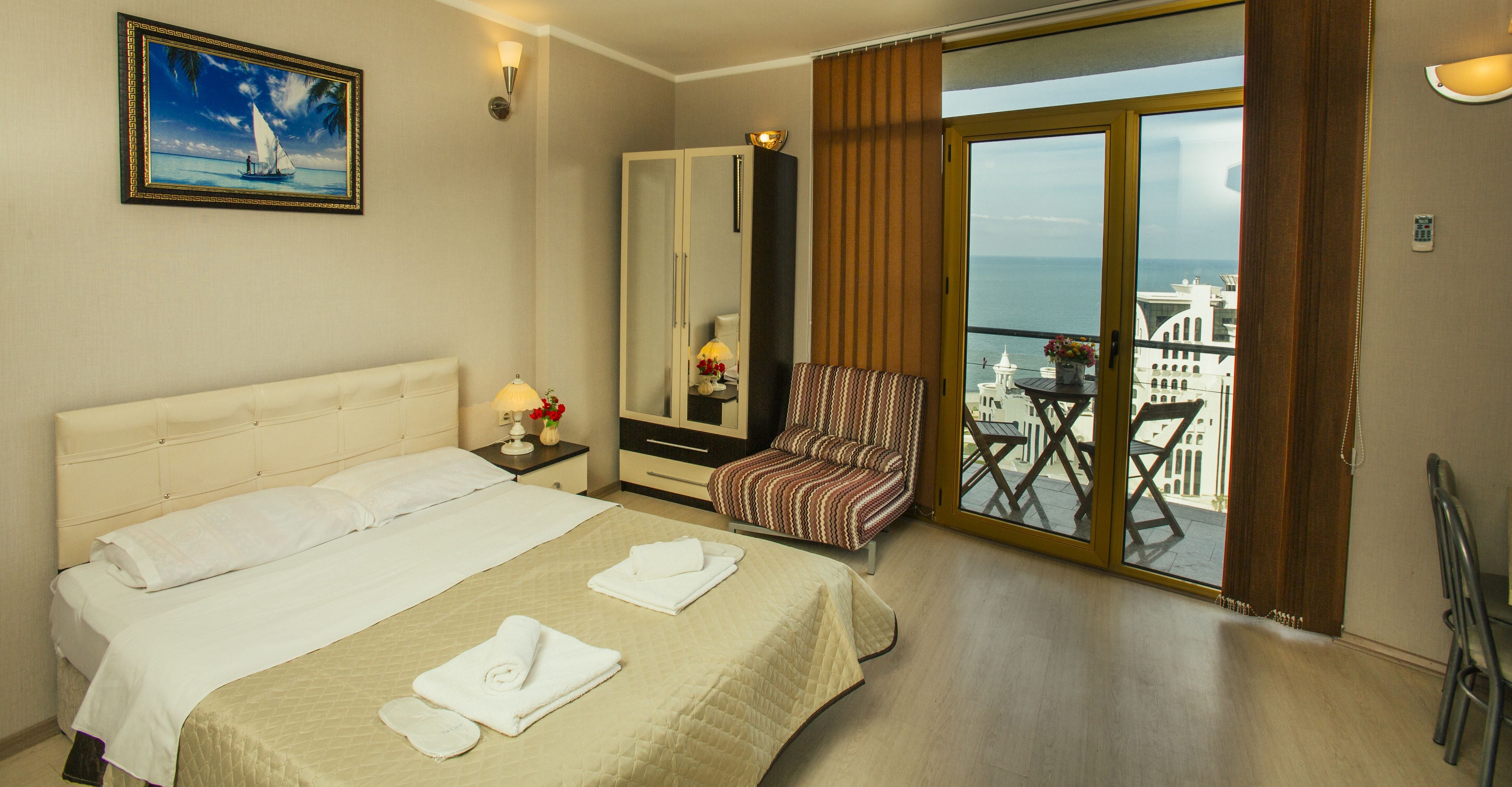 Comfort Studio, Kitchen, Beach View | Living area | Flat-screen TV, fireplace, Netflix, printers