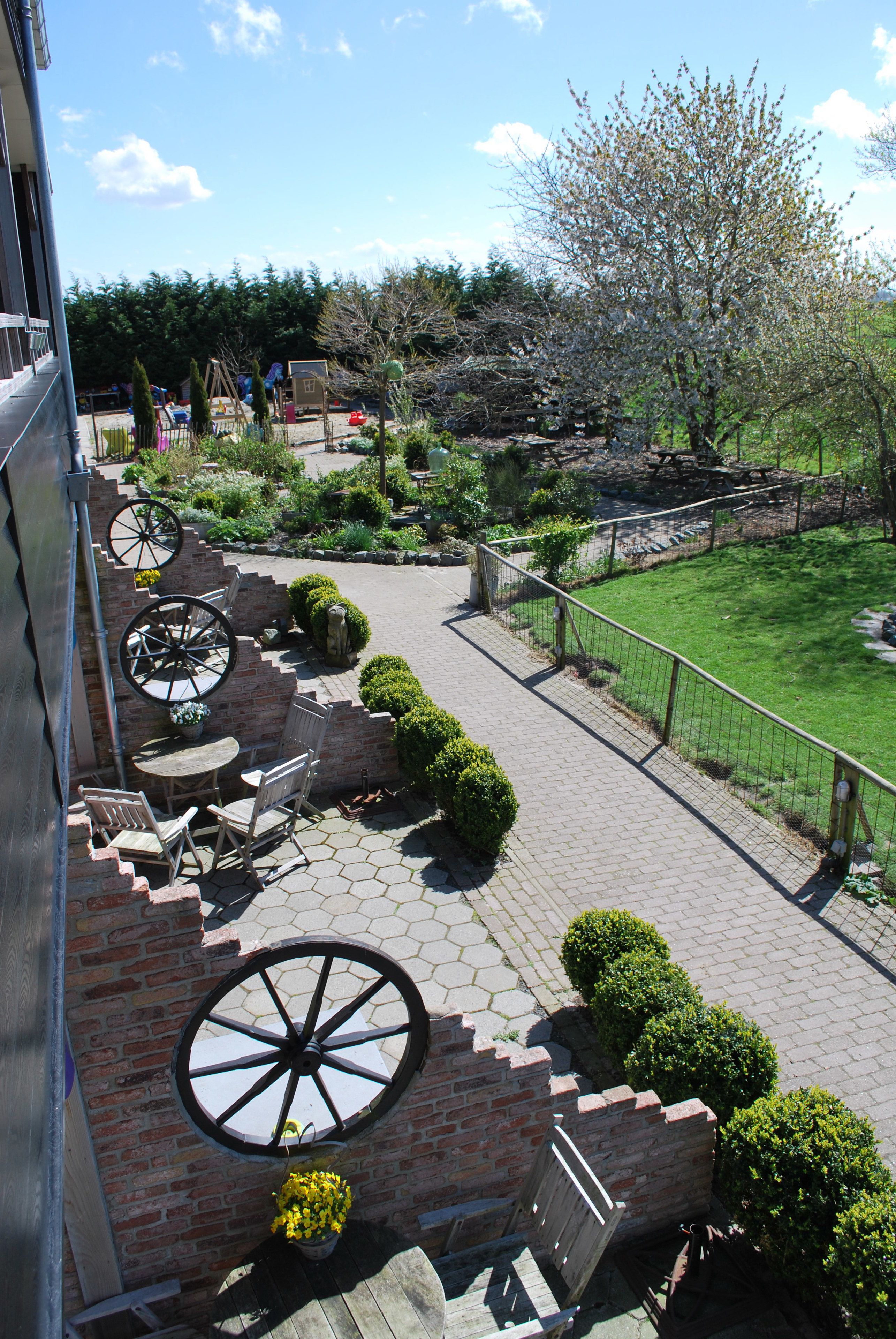 A patio area with brick steps, a table, and chairs.