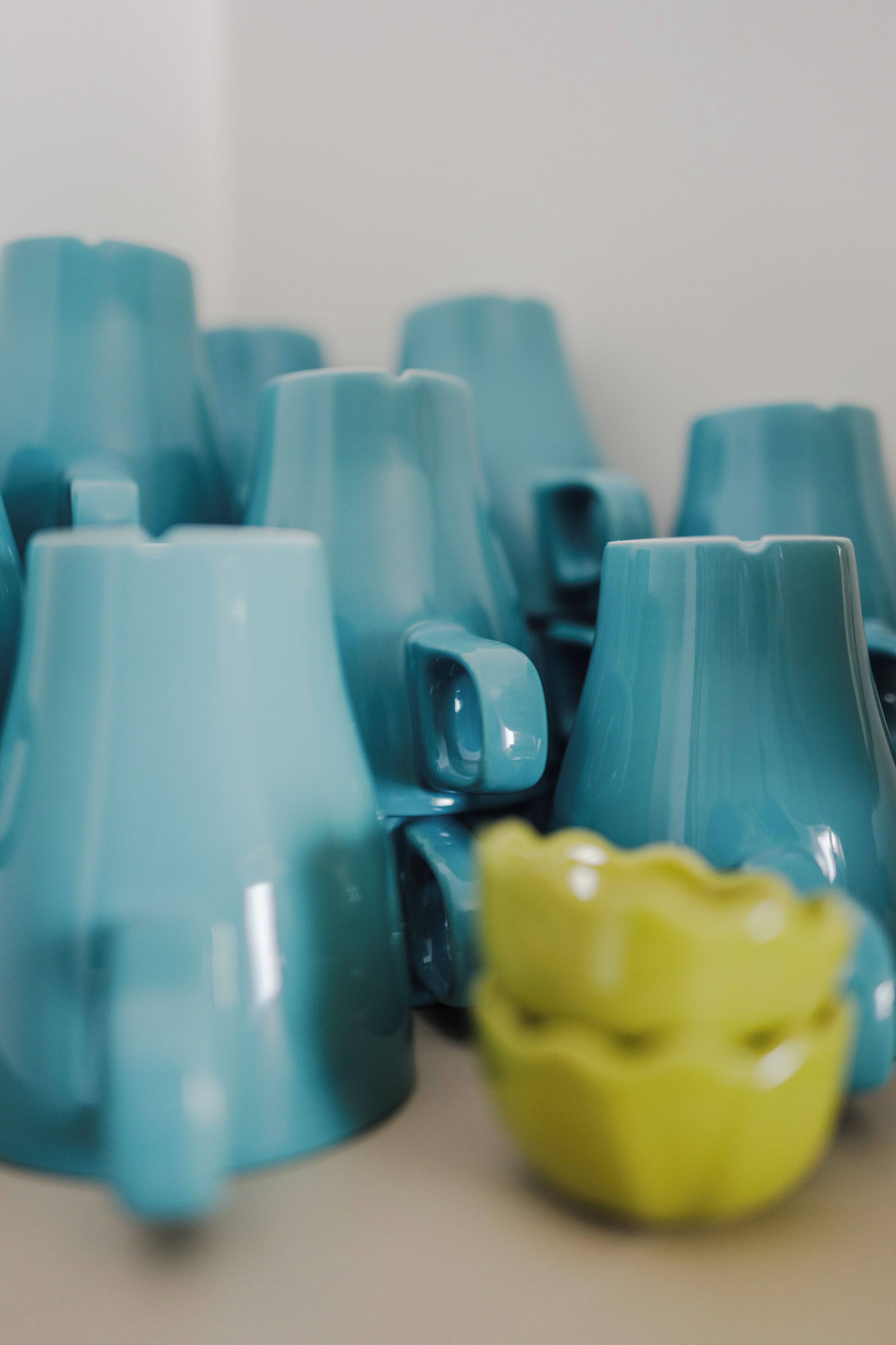 A collection of ceramic cups in various shapes and sizes.