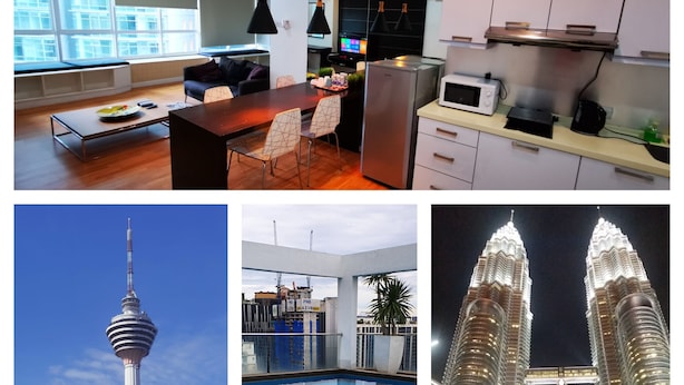 A modern kitchen with a dining area, a swimming pool, a tower, and a famous architectural landmark. - KLCC Parkview Residence Suites (Kuala Lumpur)