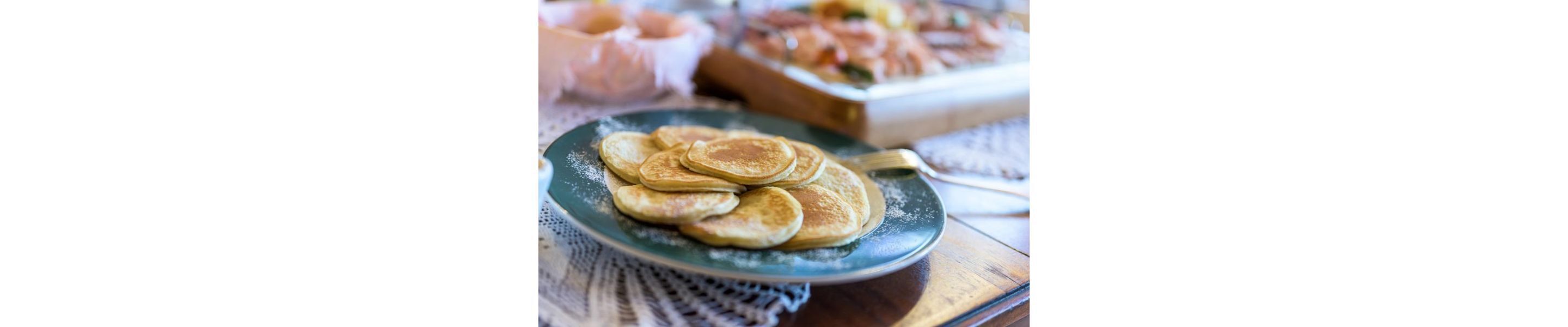 A plate of pancakes on a table.