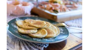 A plate of pancakes on a table.