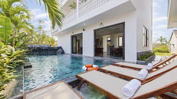 Outdoor pool, open 6 AM to 10 PM, pool umbrellas, pool loungers