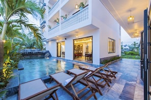 Outdoor pool, open 6 AM to 10 PM, pool umbrellas, sun loungers