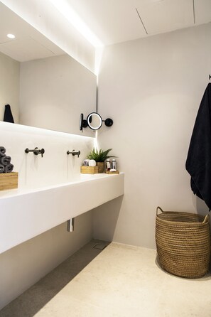 Shower, designer toiletries, hair dryer, bathrobes