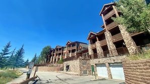 A multi-story lodge with stone and wood architecture, featuring balconies and a fire lane entrance. - Hidden River Lodge 5979 (Keystone)