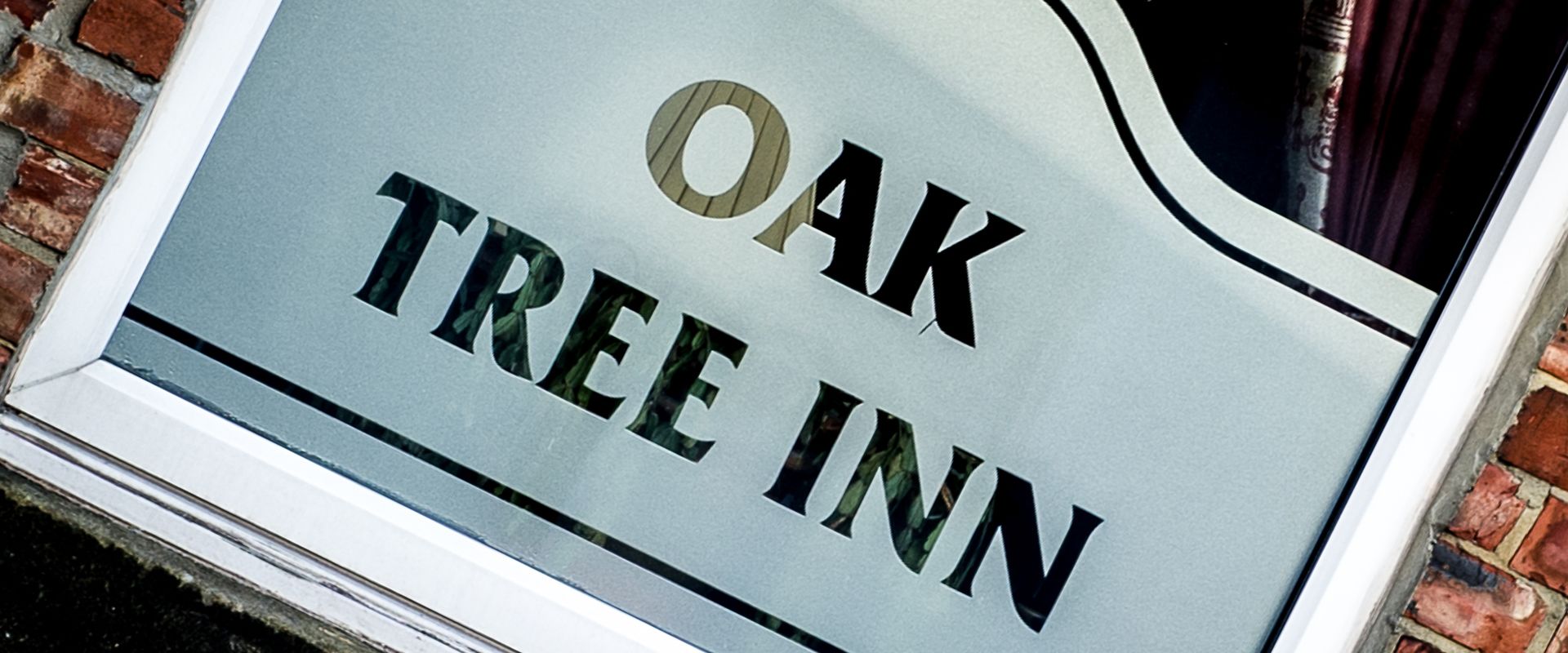 Señal para Oak Tree Inn.