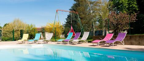 Seasonal outdoor pool, pool umbrellas, pool loungers