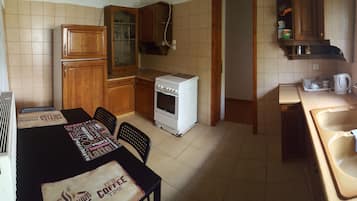 Standard Apartment | Private kitchen | Fridge, stovetop, electric kettle, cookware/dishes/utensils