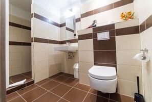 Quadruple Room | Bathroom | Shower, hair dryer, towels