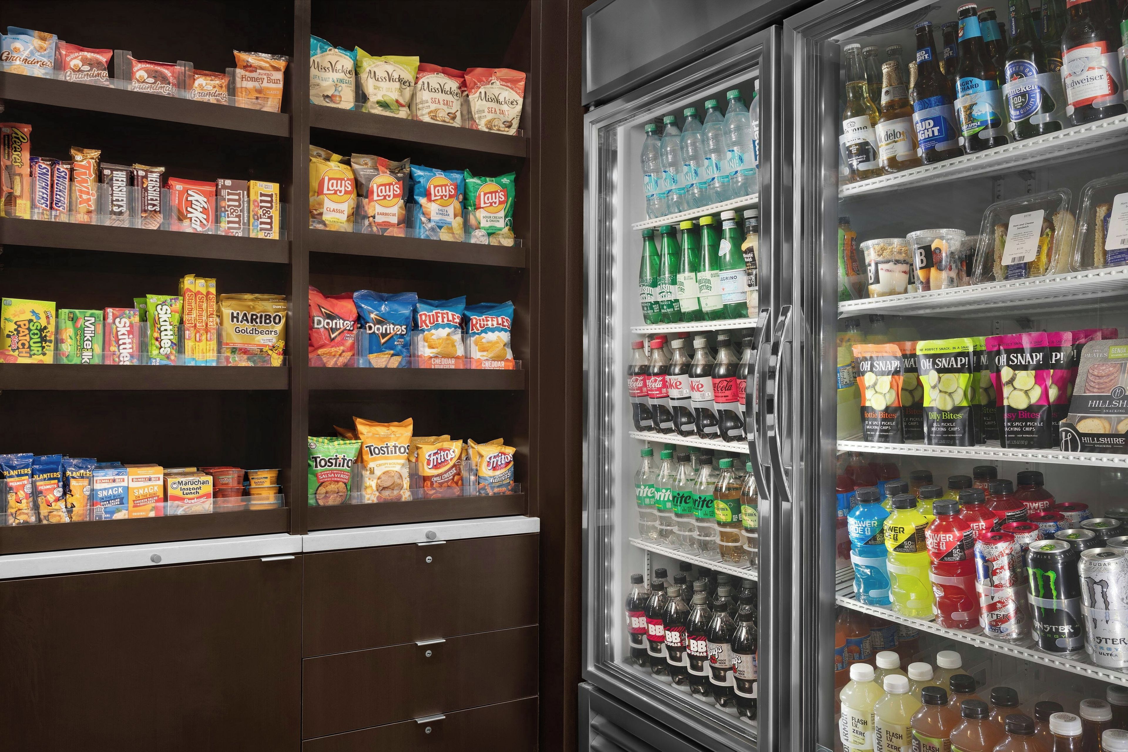 A snack and beverage vending machine stocked with various snacks and drinks.