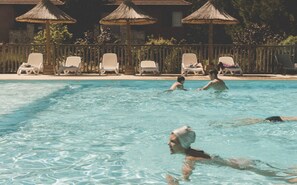 Seasonal outdoor pool, pool loungers