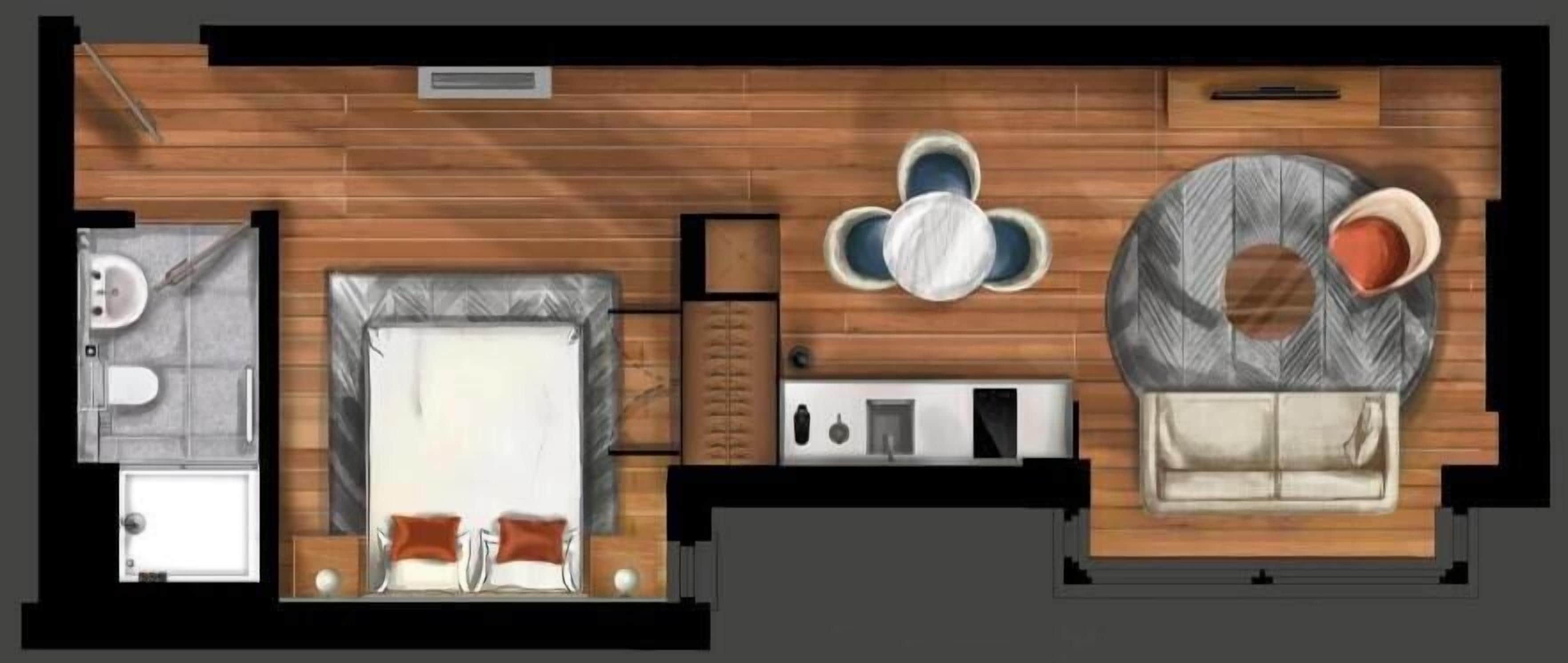 Un plan d’étage d’une chambre d’hôtel comprenant un lit, une salle de bain, un coin salon avec une table et des chaises, et un canapé.