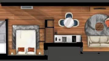 Un plan d’étage d’une chambre d’hôtel comprenant un lit, une salle de bain, un coin salon avec une table et des chaises, et un canapé.