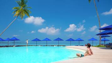 Outdoor pool, pool umbrellas, sun loungers