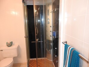 Deluxe Villa, 2 Bedrooms, Kitchen, Harbour View | Bathroom | Shower, hair dryer, towels - Villa 225E at Jolly Harbour (Jolly Harbour)