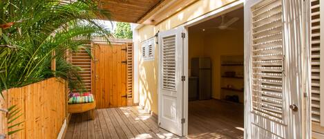 Happy Hummingbird ground floor two bedroom apartment,with garden view terrace and shared plunge pool | Terrace/patio