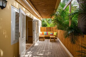 Happy Hummingbird ground floor two bedroom apartment,with garden view terrace and shared plunge pool | Terrace/patio