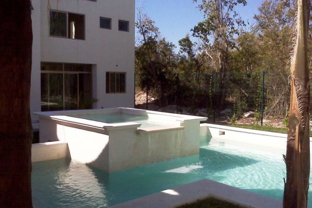 A modern building with a pool area.