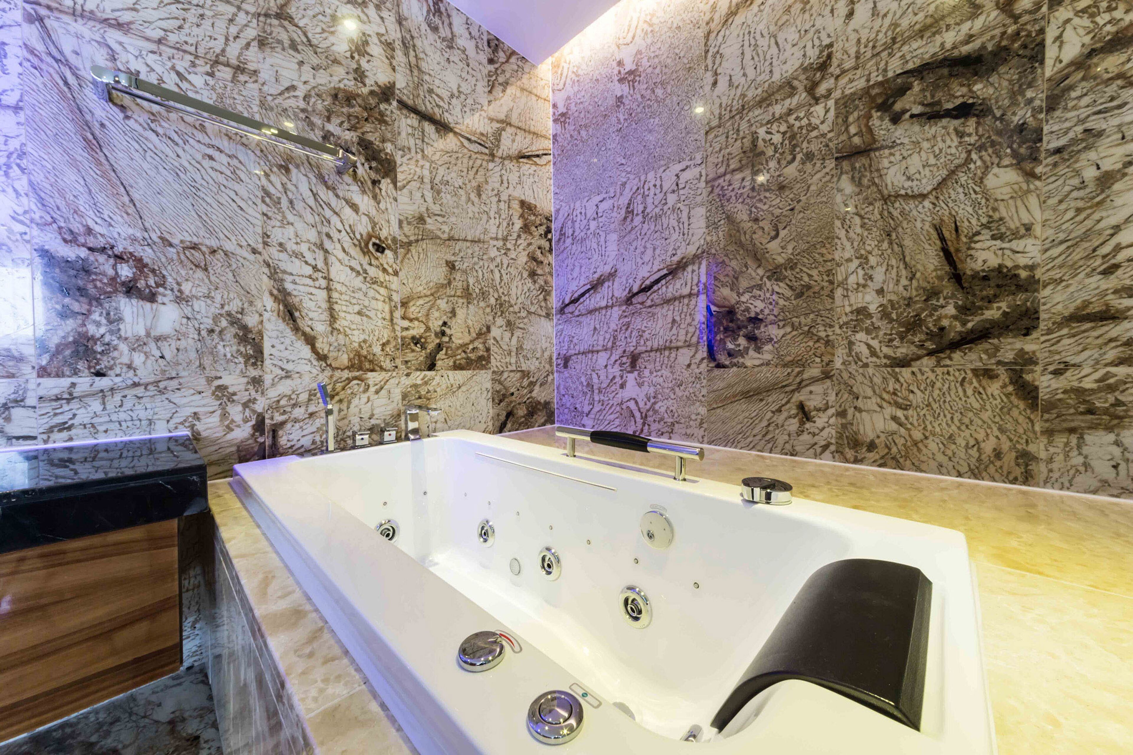 penthouse | bathroom | bathtub, jetted bath, designer toiletries, hair dryer