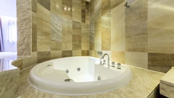 Bathtub, jetted bath, designer toiletries, hair dryer