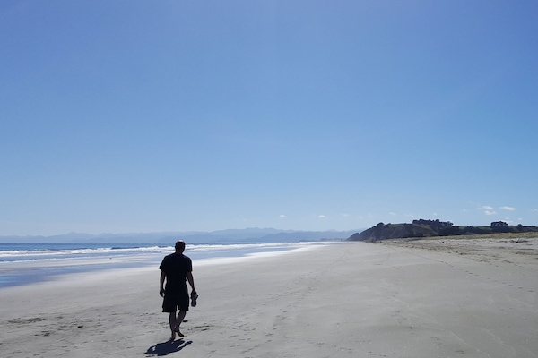 Beach nearby, white sand, beach towels