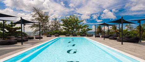 Outdoor pool, open 9 AM to 10 PM, pool umbrellas, pool loungers