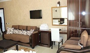 Standard Triple Room | Living area | LCD TV