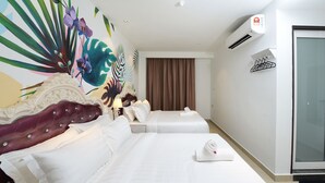 A hotel room with two beds, a large floral mural, a modern air conditioning unit, and a glass door. - Hotel de Art USJ 21 (Subang Jaya)