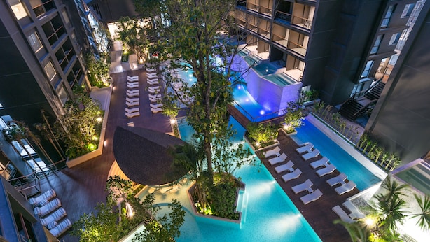 An aerial view of a hotel with multiple swimming pools, lush greenery, and modern architecture. - Panan Krabi Resort (Krabi)