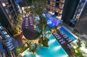 An aerial view of a hotel with multiple swimming pools, lush greenery, and modern architecture. - Panan Krabi Resort (Krabi)