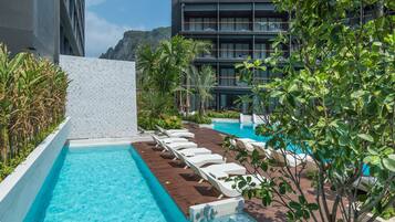 2 outdoor pools, open 7:00 AM to 9:00 PM, pool umbrellas, sun loungers