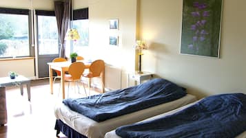 Family Room, Private Bathroom, Garden View | Blackout drapes, free WiFi, bed sheets