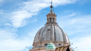 A historic building with a large dome and a smaller dome, surrounded by traditional tiled roofs. - Rent In Rome - Vittoria Terrace (Rome)