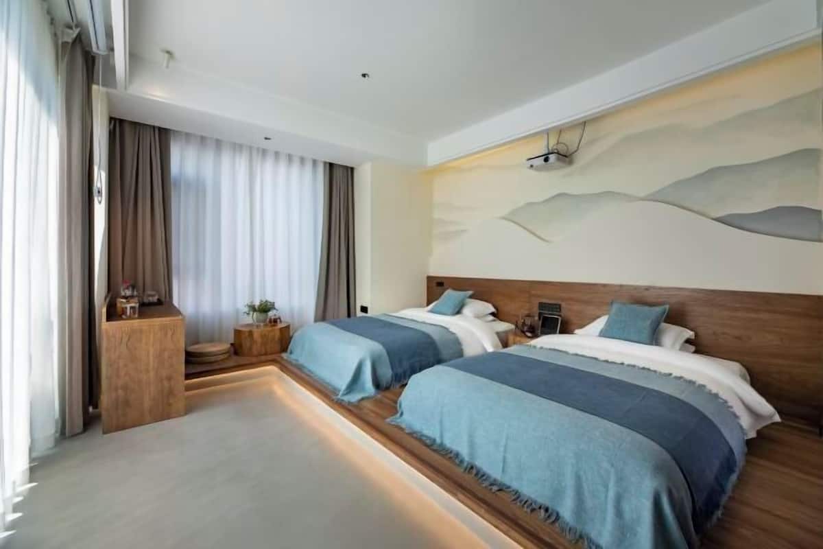 Premium bedding, down duvets, in-room safe, desk