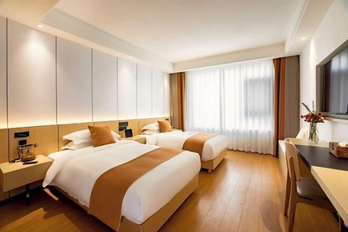 Premium bedding, down duvets, in-room safe, desk