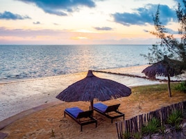Beach nearby, white sand, sun loungers, beach umbrellas