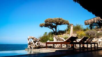 Outdoor pool, an infinity pool, sun loungers