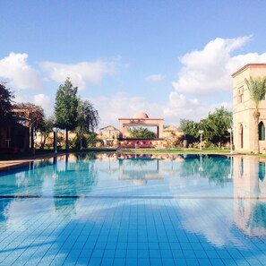 Outdoor pool, free pool cabanas, pool umbrellas