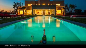 Outdoor pool, pool umbrellas, sun loungers