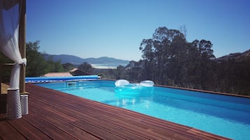 Seasonal outdoor pool, pool umbrellas, sun loungers