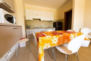 Apartment, 2 Bedrooms | Private kitchen | Fridge, microwave, stovetop, electric kettle - Cosmopolitan Golf & Beach Resort (Pisa)