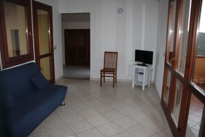 Apartment, 1 Bedroom | Living room | TV