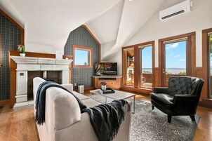 Carriage House | Living area | Flat-screen TV, fireplace, DVD player, video library