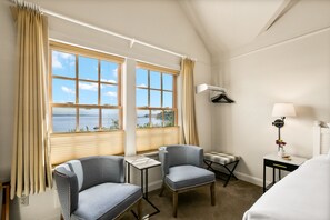 Deluxe King Room w/ Sea View | Living area | Flat-screen TV, fireplace, DVD player, video library