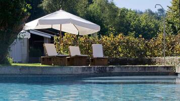 Outdoor pool, pool umbrellas, sun loungers