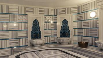 Une salle de bain avec un sol en marbre, deux lavabos et un grand miroir.