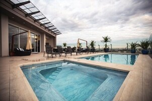 Outdoor pool, open 10:00 AM to 10:00 PM, sun loungers