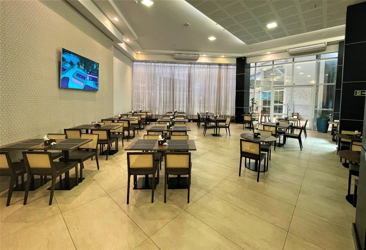 A conference room with tables and chairs arranged for meetings.
