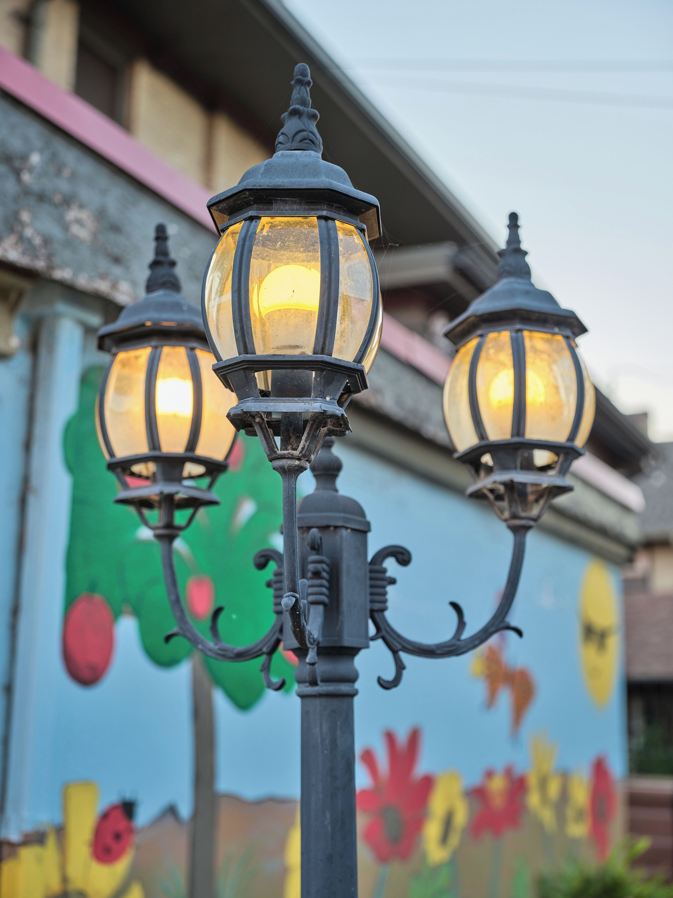 A street lamp with three lights.